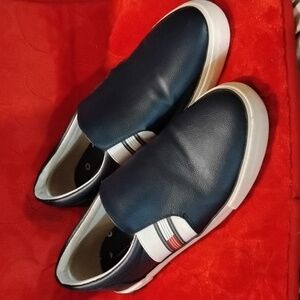 Tommy Hilfiger shoes.  Blue in color with Red white and blue stripes. Size 10.